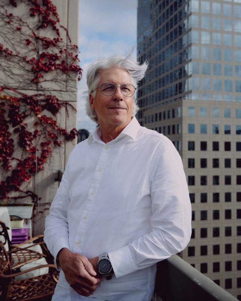 Dave Popple, seen here on his home terrace in New York, says his work is often more therapy than coaching.